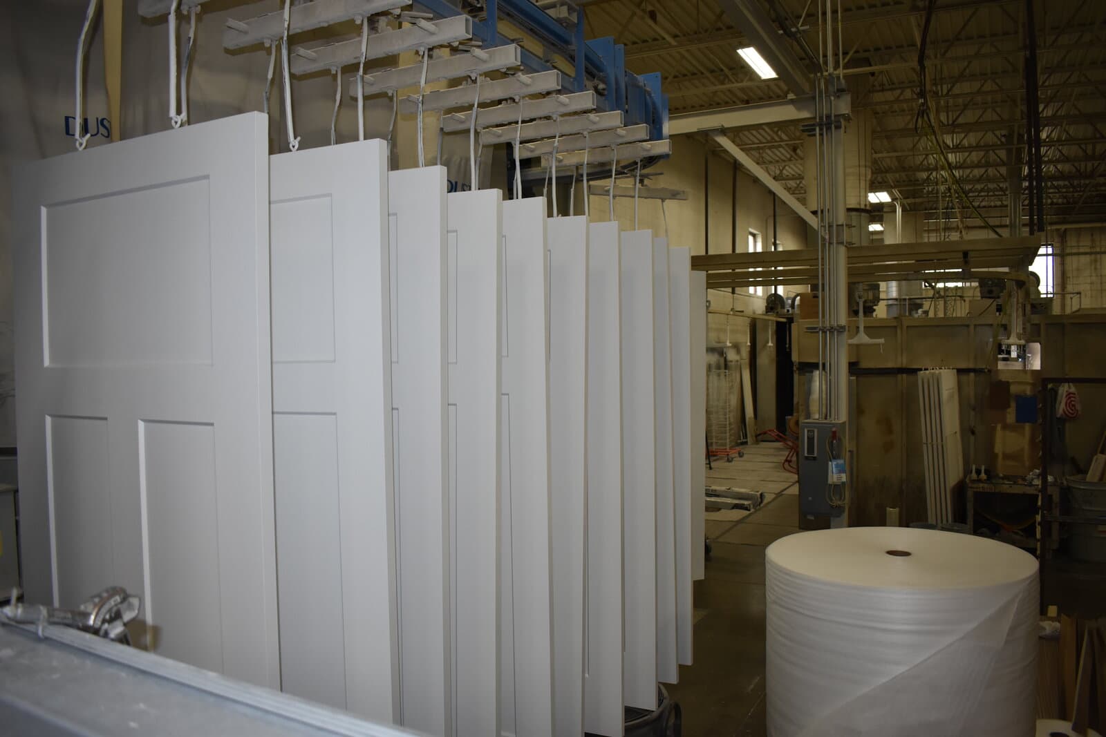Industrial spray finishing equipment in operation